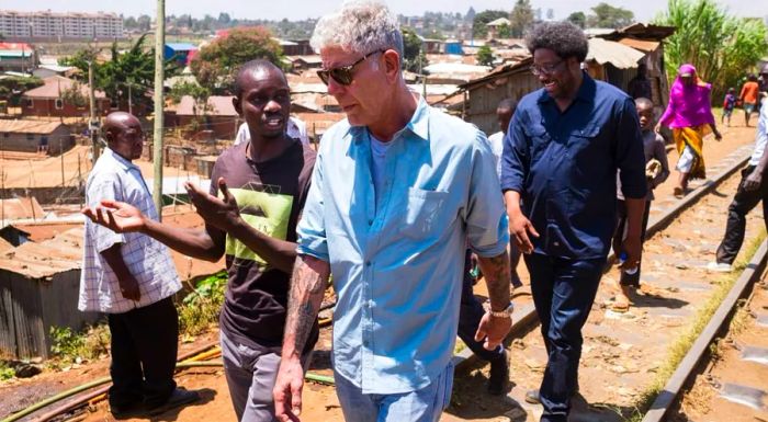 Nairobi, Kenya: Anthony Bourdain with W. Kamau Bell in the Kibera slums of Nairobi, captured in February 2018 during the filming of Season 12 of 'Parts Unknown.'