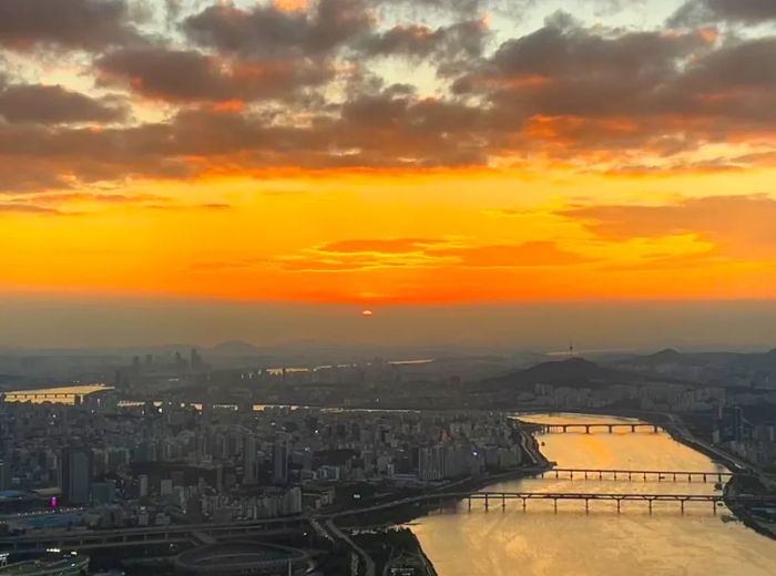 A stunning sunset view from the Sky Seoul observatory in the Lotte World Tower.