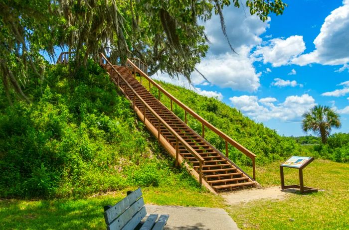 Outdoor staircase leading to a sign during the day.