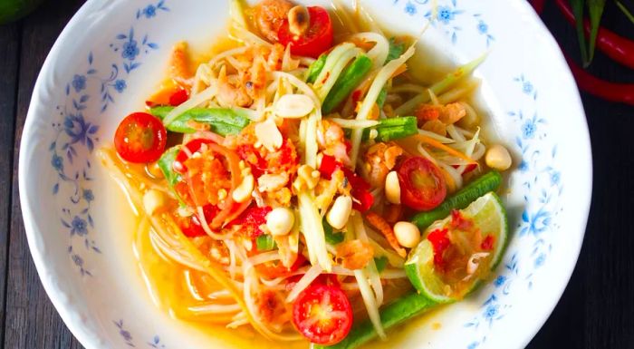 A zesty green papaya salad with a fiery kick.