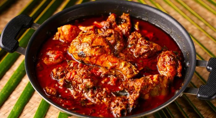 This aromatic dish features chicken slowly cooked with a blend of roasted spices and coconut, creating a rich, flavorful experience.