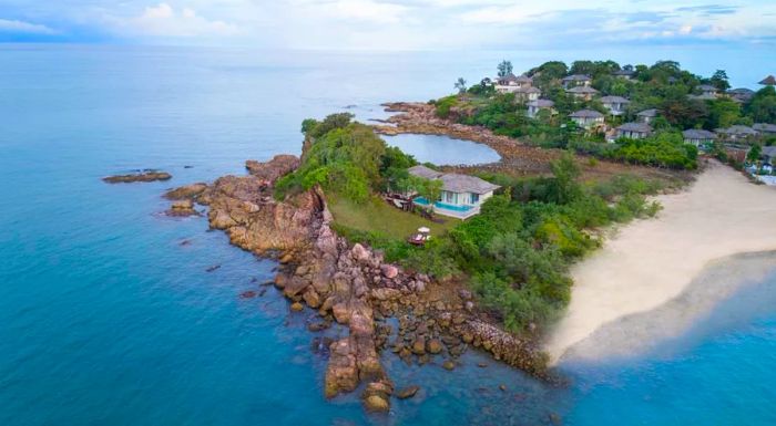 An aerial view of Fahn Noi Island, a generous two-bedroom villa, isolated from the main part of Cape Fahn.