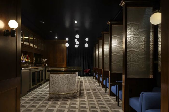 A moody, dimly lit speakeasy bar inside the JFK Centurion Lounge