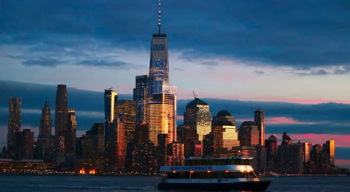 The iconic skyline of lower Manhattan and the towering One World Trade Center in New York City.