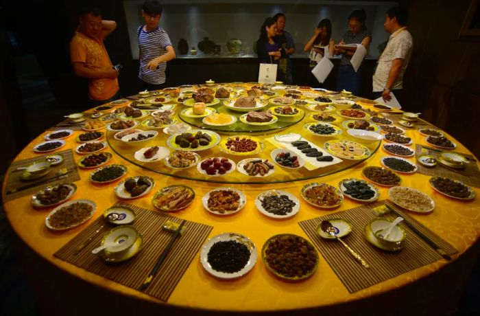 At a gem exhibition in China, a display made from stones was inspired by the legendary Manchu Han Imperial Feast, often mistakenly believed to have originated in the Forbidden City.