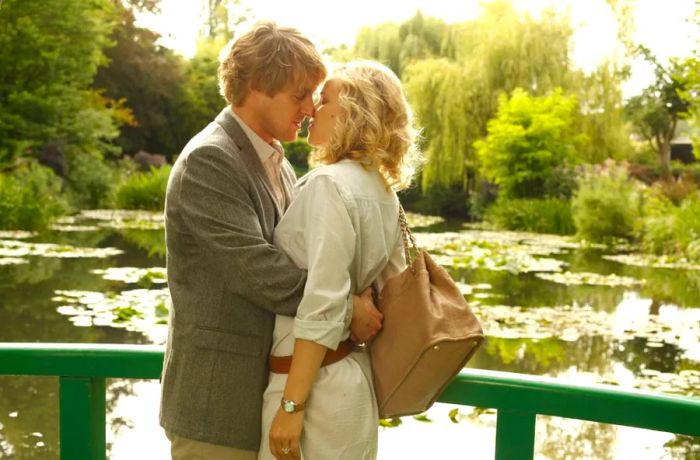 A memorable moment from Woody Allen's 2011 film *Midnight in Paris*, featuring Owen Wilson and Rachel McAdams.