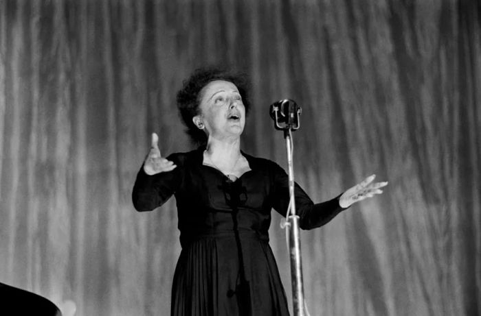 French singer Edith Piaf graces the stage at the Olympia concert hall in Paris on December 30, 1960.