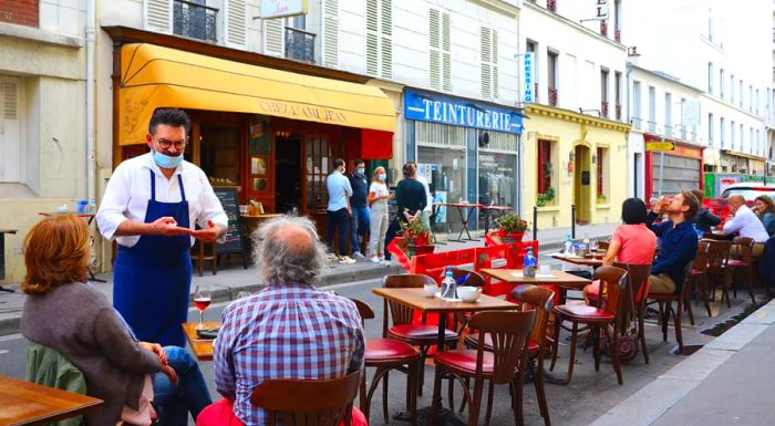 Chez L'Ami Jean has reopened with additional outdoor seating set up along the sidewalk in Paris.