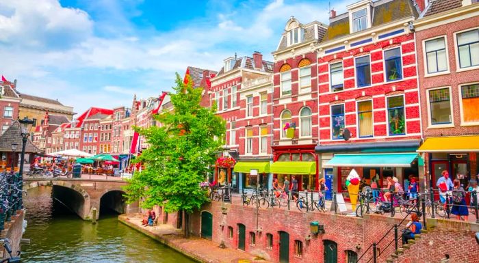 If you want to avoid the hustle and bustle of Amsterdam, Utrecht offers a charming alternative with its historic streets, buildings, canals, and a thriving cycling culture.