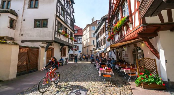 Petite-France is a charming medieval neighborhood known for its picturesque half-timbered houses. It's a popular spot for tourists, including those exploring by bike.