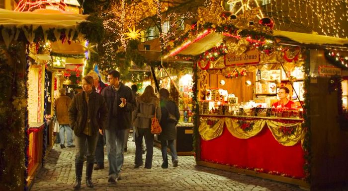 The Basel Christmas Market features nearly 200 wooden stalls offering a variety of Christmas spices, festive decorations, and candles.