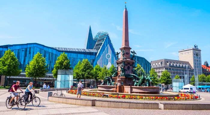 Like much of Leipzig, Augustusplatz is a cyclist-friendly area. It features cultural landmarks like the Oper Leipzig (opera house) and the Mendebrunnen fountain in front of the Gewandhaus concert hall.