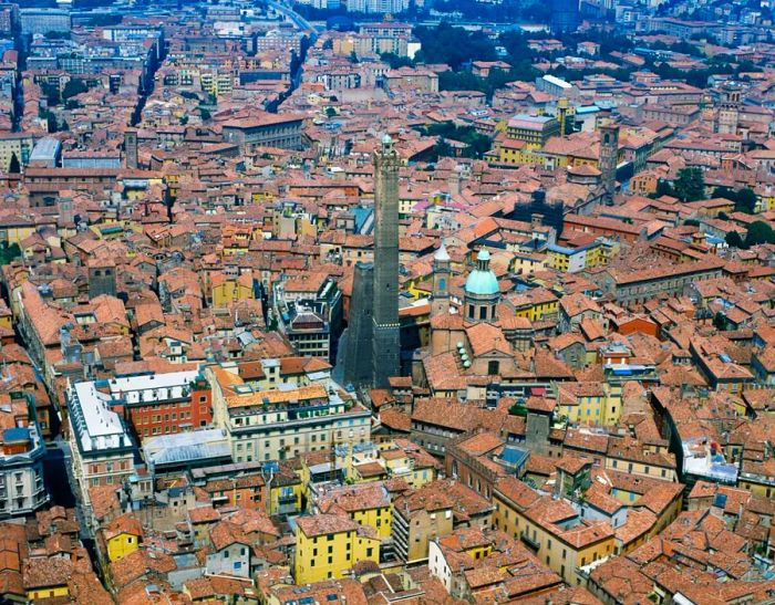 The Garisenda Tower, situated beside the taller Asinelli, leans at a four-degree angle.