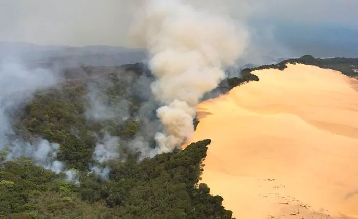 A bushfire continues to spread across Australia’s Fraser Island.