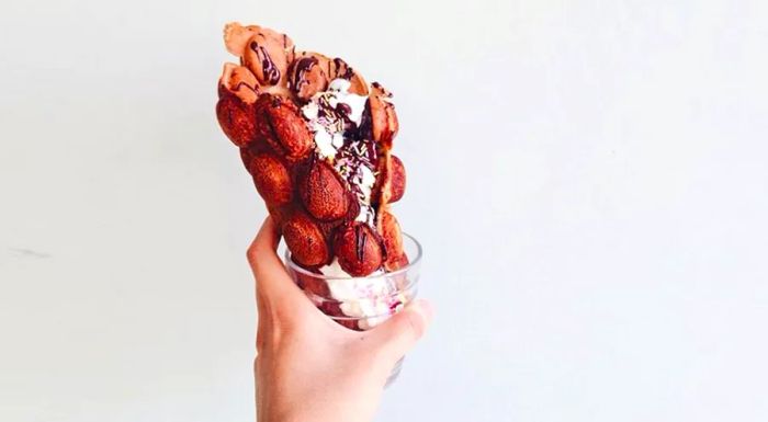 The modern take on gai daan jai: the waffle is now shaped into a cone and filled with indulgent ice cream or whipped cream.