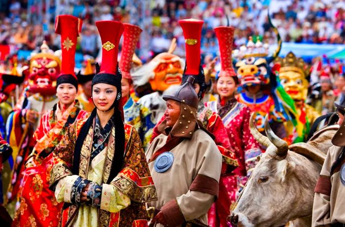 The Naadam Festival kicked off the 800th anniversary celebrations of the Mongolian State in the National Stadium, with an actor portraying Genghis Khan playing a key role in the grand spectacle. (Photo by In Pictures Ltd./Corbis via Getty Images)