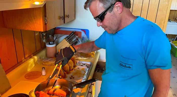 On Tuesday evening, John 'Wedge' Wardlaw was busy frying tacos, donning his protective gear.