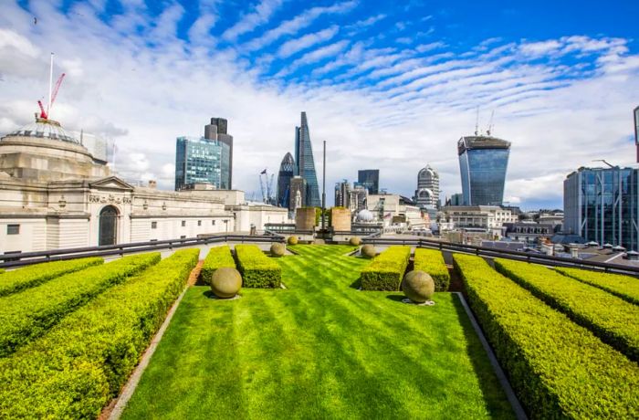 Enjoy sweeping views of London's eastern skyline from the lush lawn at Coq d'Argent.