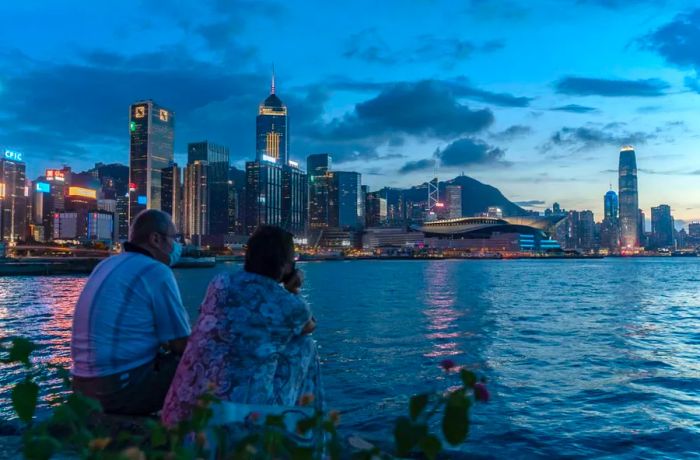 A couple enjoys the Hong Kong sunset on July 30, 2020.