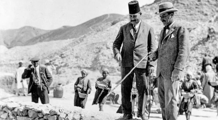 British archaeologist Howard Carter, pictured at Tutankhamun's tomb, had just made a life-changing discovery.