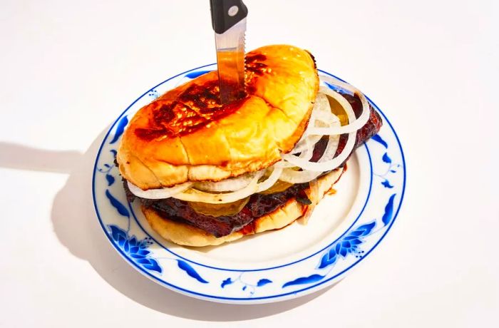 The cha siu bkrib sandwich, which features a hint of MSG in its marinade, is the standout dish at Bonnie’s, a popular restaurant in New York City.