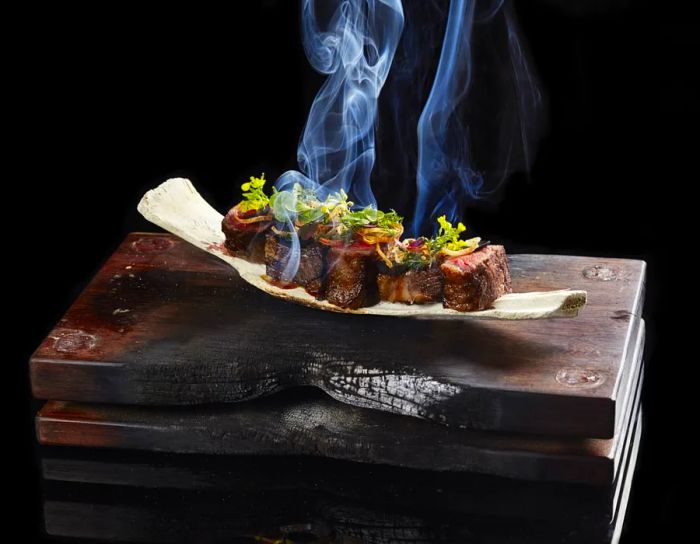 A beef dish at the Mandarin Oriental Hong Kong, garnished with wild-foraged flowers.