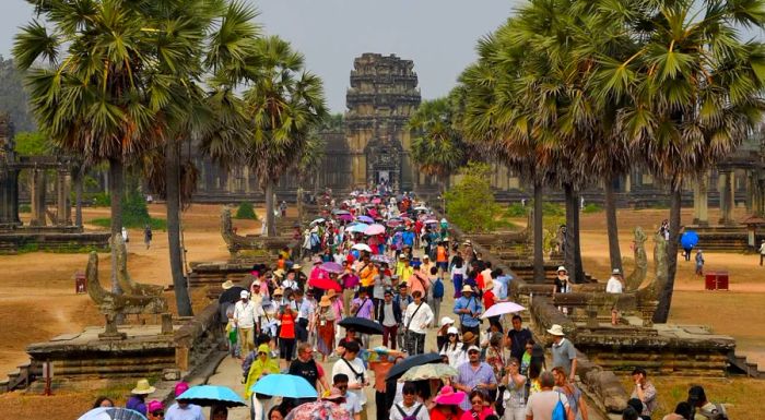 Tourists explore the Angkor Wat temple in Siem Reap province on March 16, 2019.