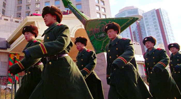 Chinese soldiers were seen marching past the Hard Rock Beijing during the 1990s.