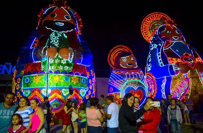 People marvel at the dazzling Christmas lights in Medellín.