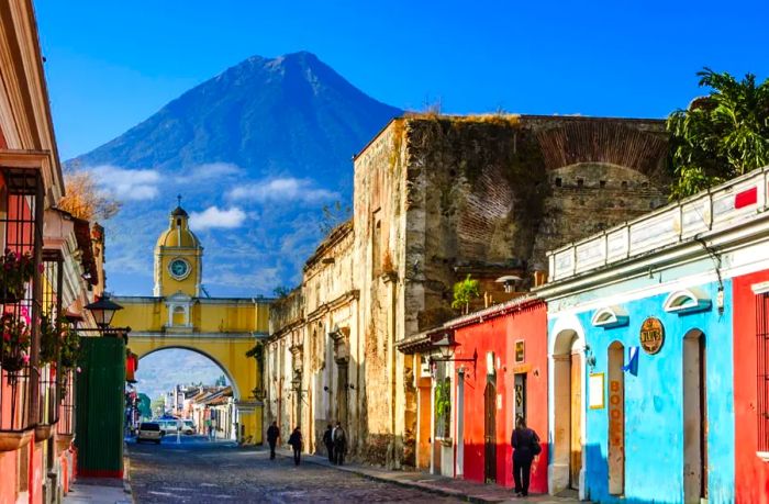 Antigua is a stunning Spanish colonial city in Guatemala, with a majestic volcano as its dramatic backdrop.