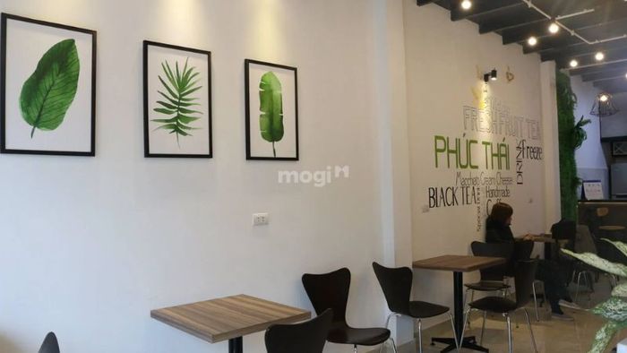 Trang trí tường quán cafe bằng tranh và hình ảnh
