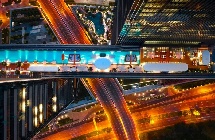 The pool hangs 100 meters above the ground, with only a six-lane highway beneath it.