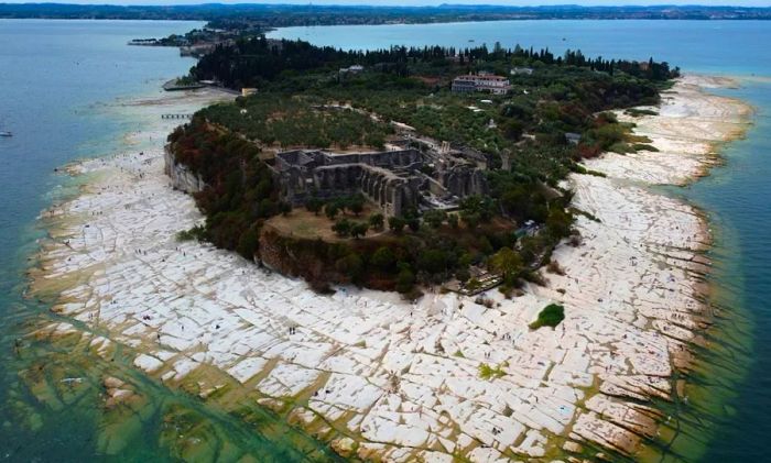 Lake Garda's water levels have significantly dropped in areas like Sirmione.