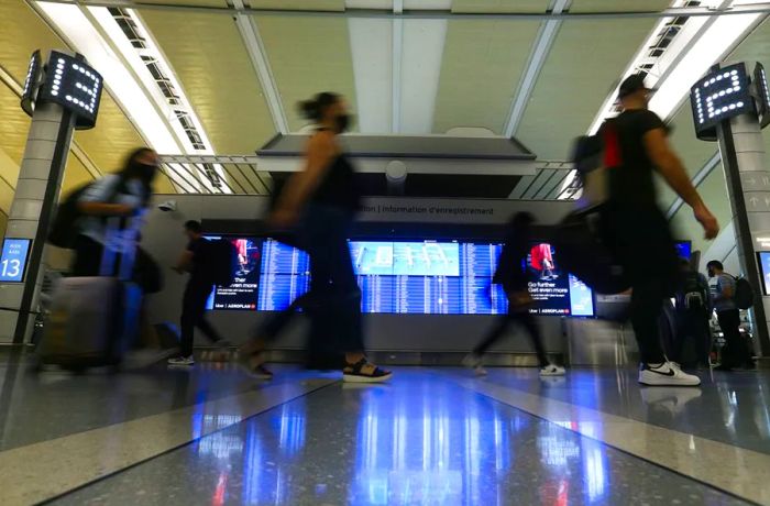 Travelers at Toronto Pearson International Airport on July 22, 2022. Over half of the arrivals were delayed at the airport this summer.