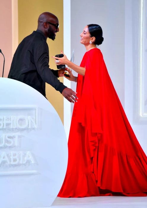 Amina Muaddi receives the Special Recognition Award for Entrepreneur of the Year from the late Virgil Abloh at the Fashion Trust Arabia Prize Gala on November 3, 2021, held at the National Museum of Qatar in Doha.