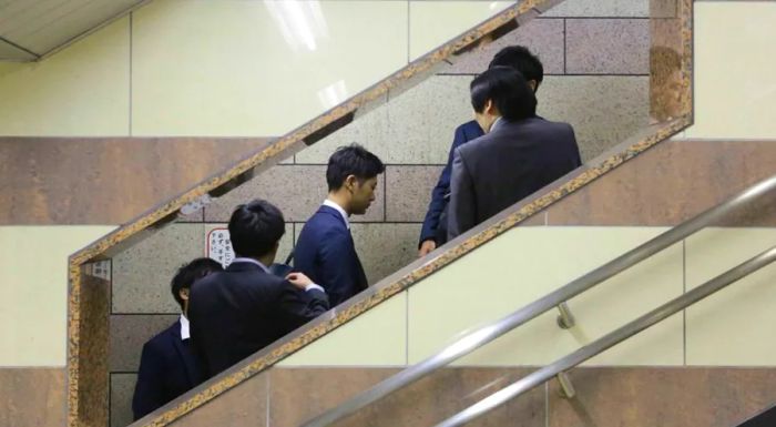 Rising fast: Salarymen speeding through Tokyo’s fast-paced work culture.