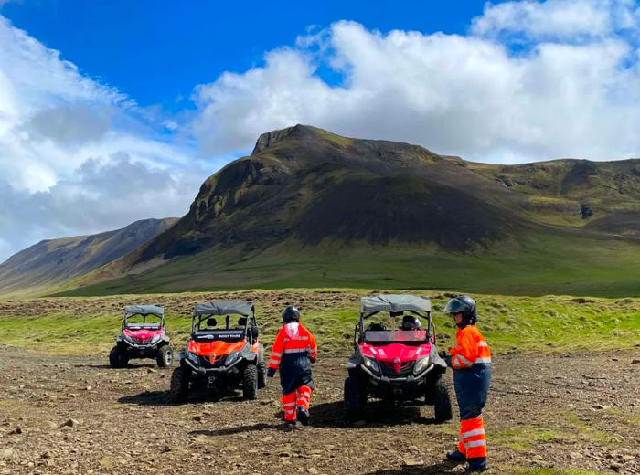 Visitors gear up to ride ATVs near Seljalandsfoss as part of a tour to the Þórsmörk Valley.