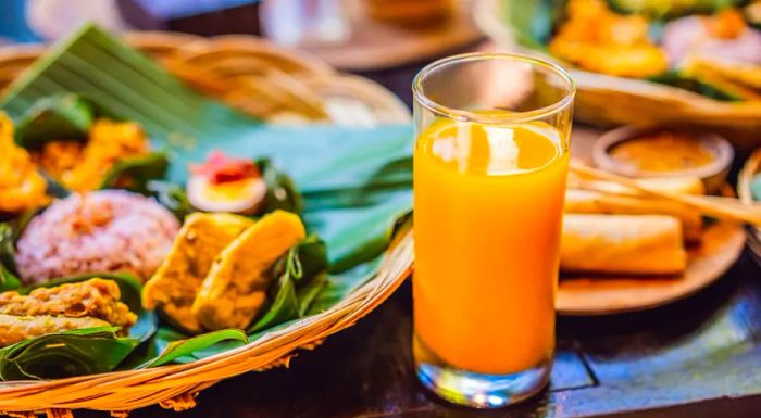 Jamu is a potent herbal drink crafted from ginger and turmeric, known for its health benefits.