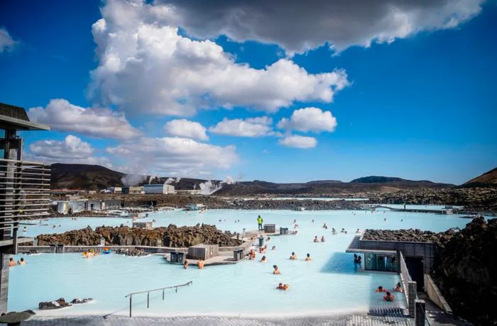 The Blue Lagoon, a famous geothermal spa in Reykjavik, draws many visitors. Tourism is on the rise in Iceland, which is now welcoming vaccinated international travelers.