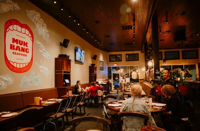 Diners enjoy a meal at Mukbang Seafood and Bar in New Orleans.