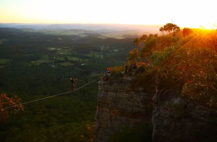 The Blue Mountains are a magnet for adventure enthusiasts, including line walkers who are secured with safety harnesses.