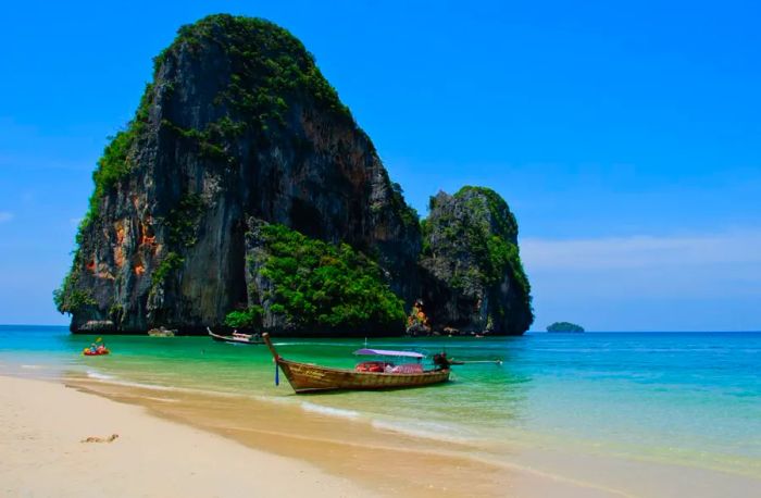 Phra Nang Beach in Railay, Thailand, is like stepping into a surreal Dali-inspired dream.