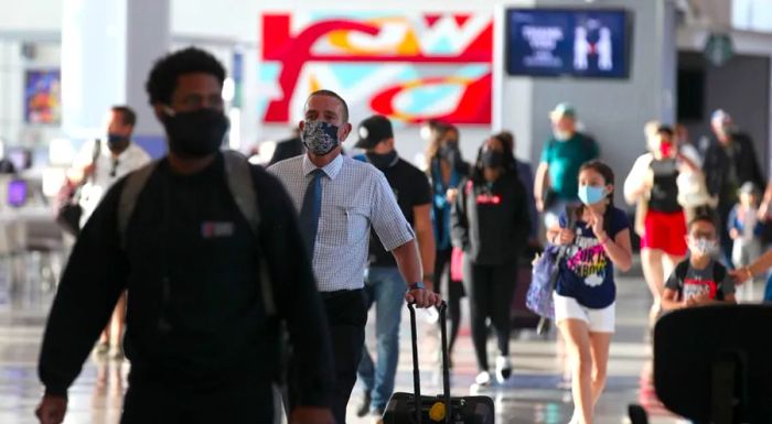 In May 2020, passengers at the United Airlines terminal of George Bush Intercontinental Airport in Houston, Texas.