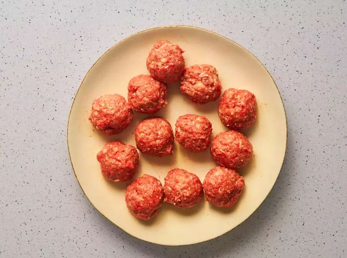 The meat mixture shaped into balls.