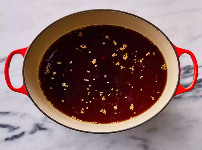 Top-down shot of brine resting in a large pot, ready for use.