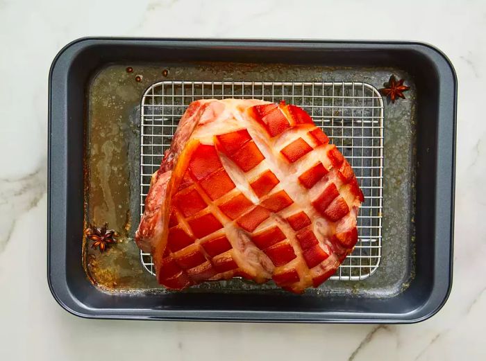 Top-down view of the cooked roast resting on a cooling rack.