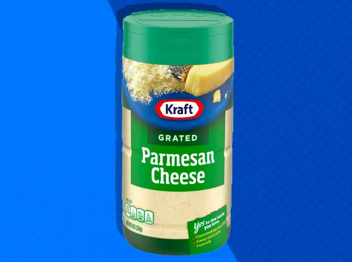 Kraft's grated Parmesan cheese bottle against a two-tone blue background