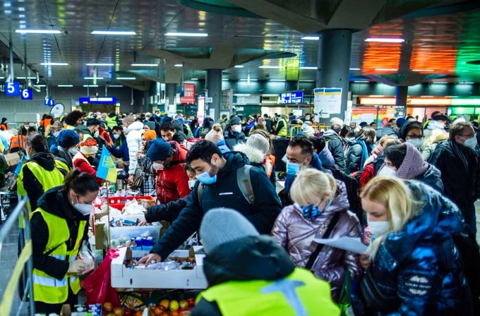 Schiff mentions that Berliners are stepping up to volunteer at the city’s railway stations to assist those arriving.