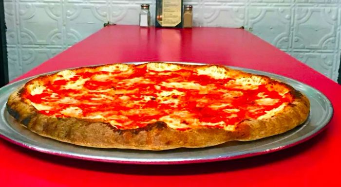 Totonno’s, located in Coney Island, has been serving pizza since 1924, making it one of the oldest and most iconic pizzerias in the United States.