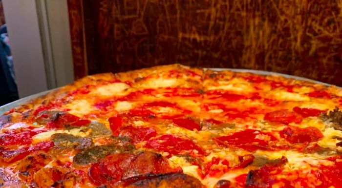 A sausage and pepperoni pizza from John's of Bleecker Street stays perfectly crisp, even with the generous amount of meat piled on top.